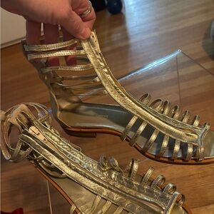 Stephane de Roucourt gold gladiator open toe sandal.